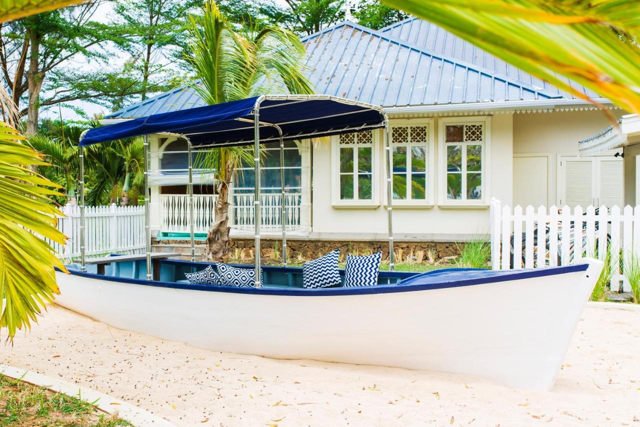 Heritage Le Telfair Golf & Wellness Resort Bel Ombre Kültér fotó The boat house at the beach
